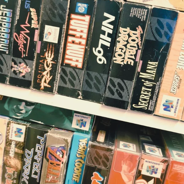 Boxed SNES and Genesis games on the shelf